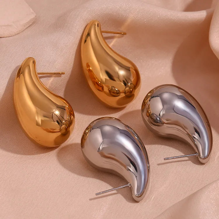 Close up front and side view of elegant 18k Gold and Silver plated stainless steel, Bottega designer-inspired teardrop earrings with a smooth, polished waterproof finish, designed with a lightweight and tarnish resistant material for timeless sophistication.