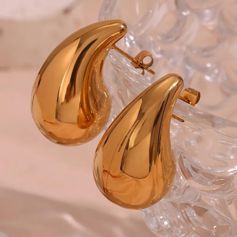 Close up front view of elegant 18k Gold and Silver plated stainless steel, Bottega designer-inspired teardrop earrings with a smooth, polished waterproof finish, designed with a lightweight and tarnish resistant material for timeless sophistication.