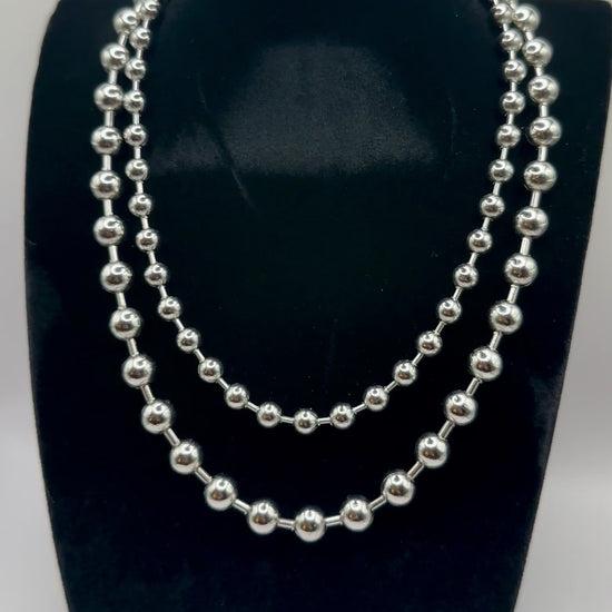 Close up view of 6 and 8mm elegant 18k Silver plated stainless steel, designer inspired,  Tiffany ball chain necklace dupe with a smooth, polished finish, designed with a lightweight and tarnish resistant material for timeless sophistication.