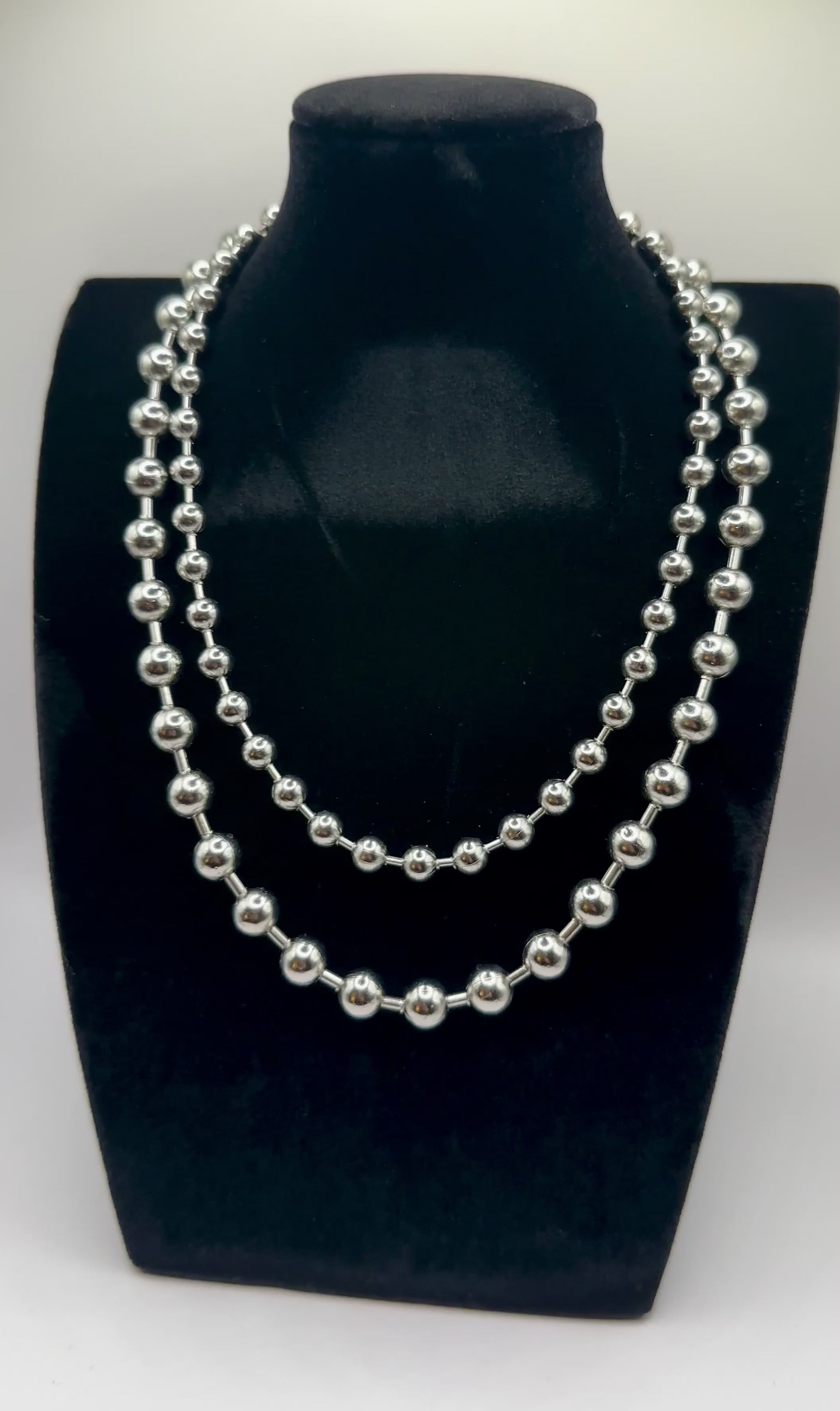 Close up view of 6 and 8mm elegant 18k Silver plated stainless steel, designer inspired,  Tiffany ball chain necklace dupe with a smooth, polished finish, designed with a lightweight and tarnish resistant material for timeless sophistication.